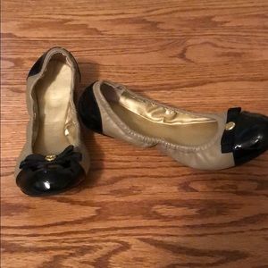 Tan and black flats.